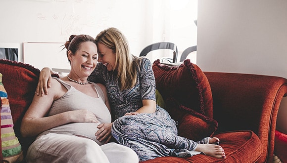Two women with a baby