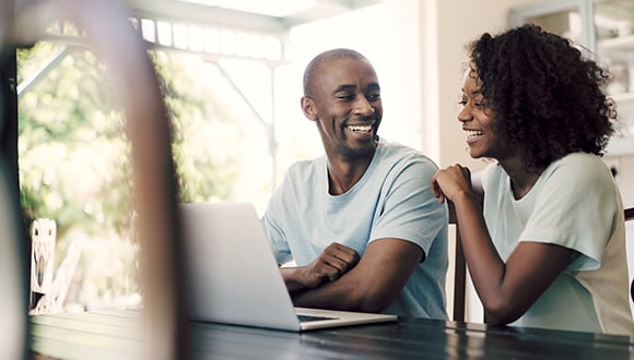 Couple looking at a laptop