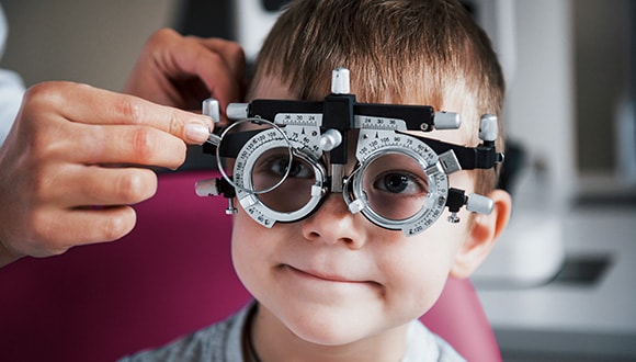 Little boy taking an eye test
