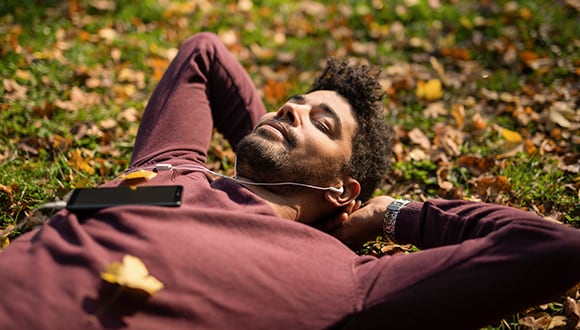 Man laying down dealing with his stress