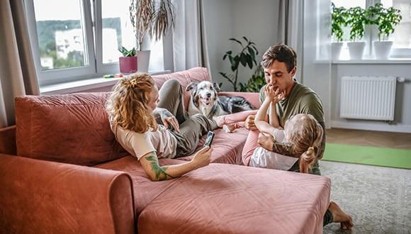 Couple playing with little girl