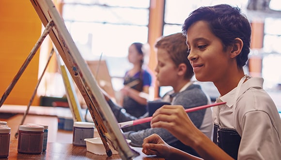 Young boys painting