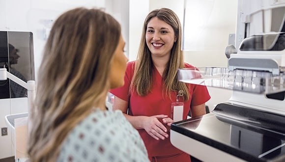 a woman gets a mammogram to check her breast health