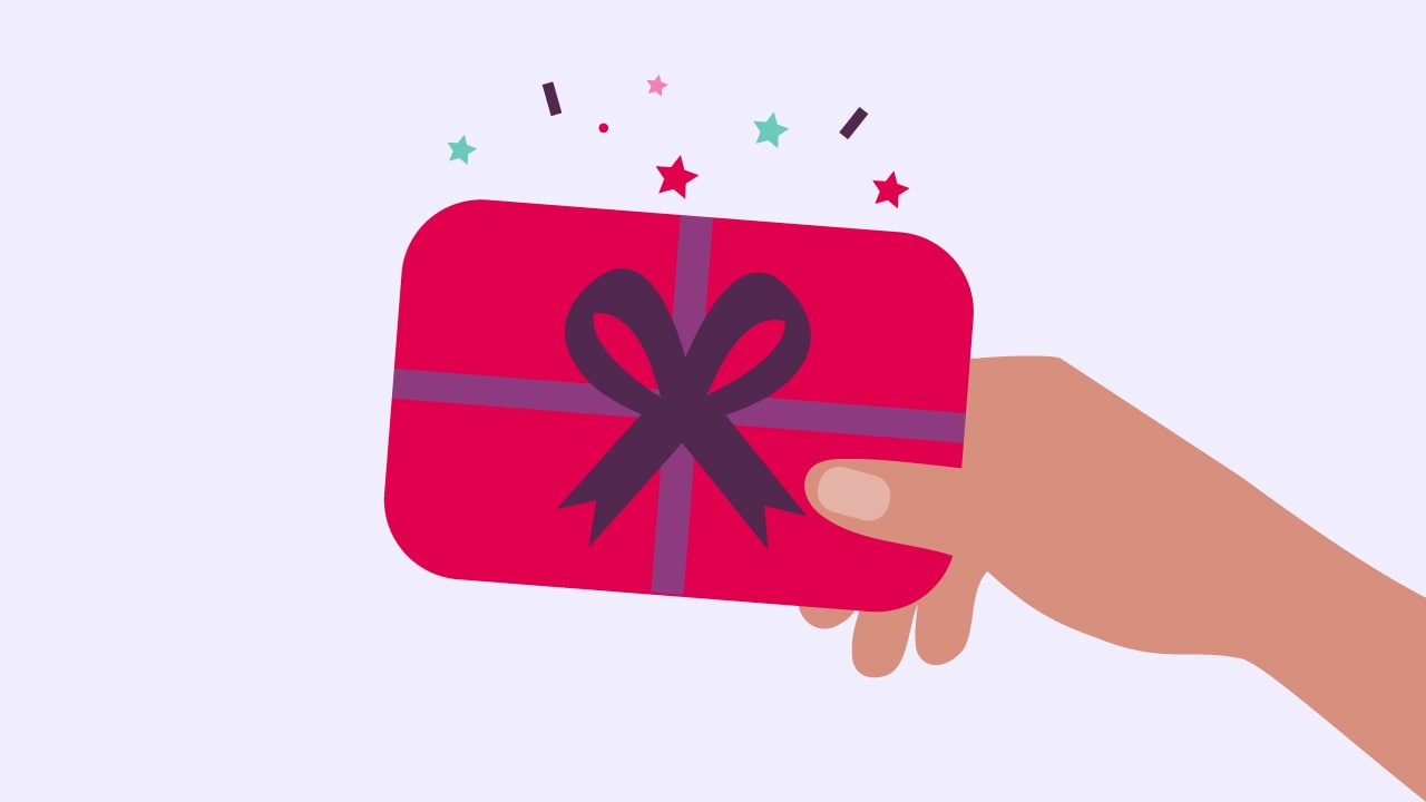 A hand holding a gift or reward card.