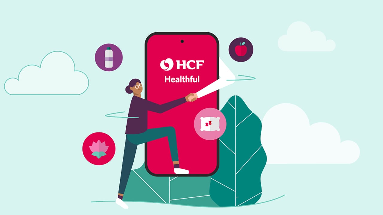 An illustration of a person standing next to a giant phone with the HCF healthful app display on it.