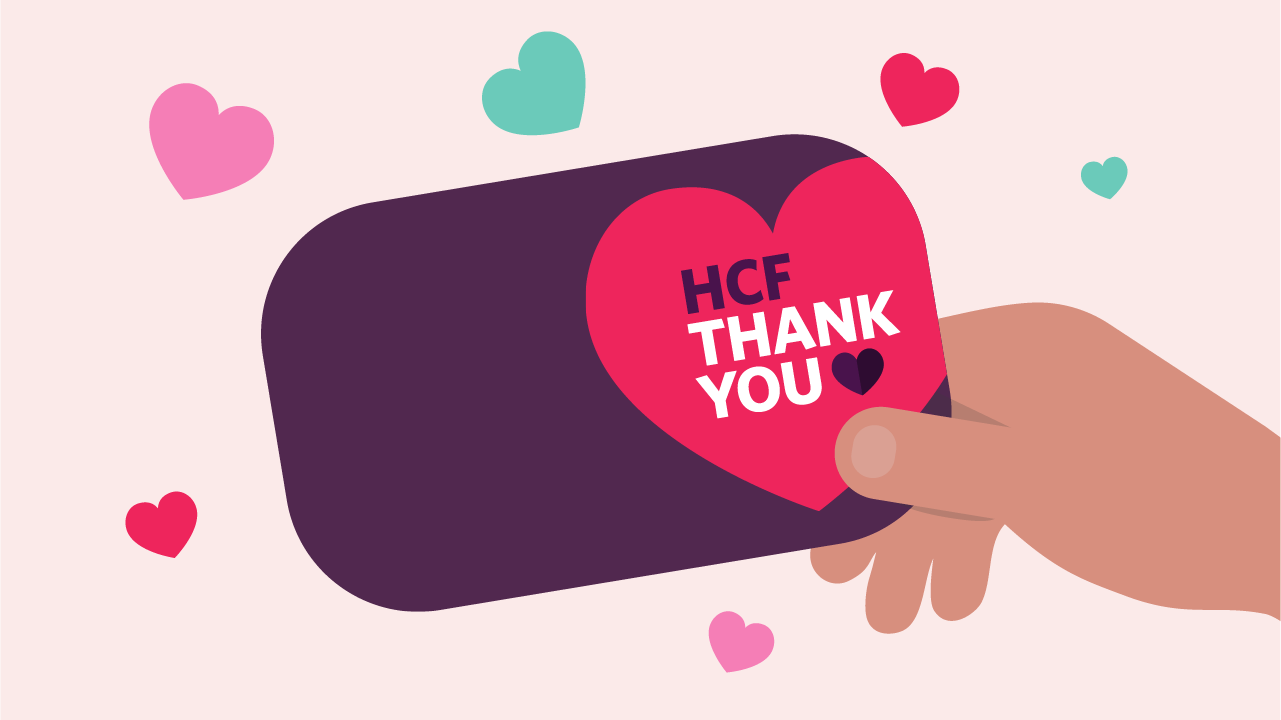 Illustration of a purple card with HCF Thank You written on it and hearts around it.