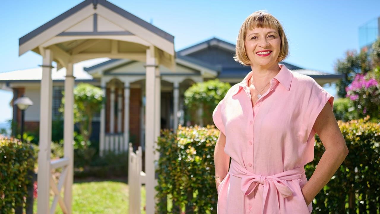 HCF member Jocelyn standing outside her house.